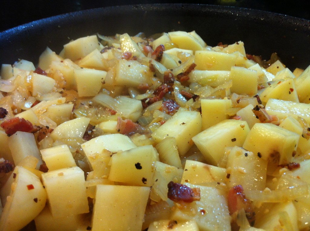Saute potatoes with onions and garlic until they look the way you like 'em